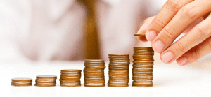 Benefits of Cash Flow Management - a man stacking coins